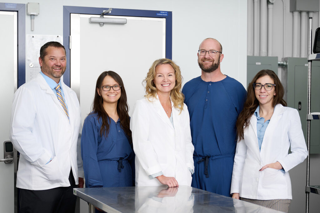 OSRX staff standing proudly after receiving dual NABP accreditations.